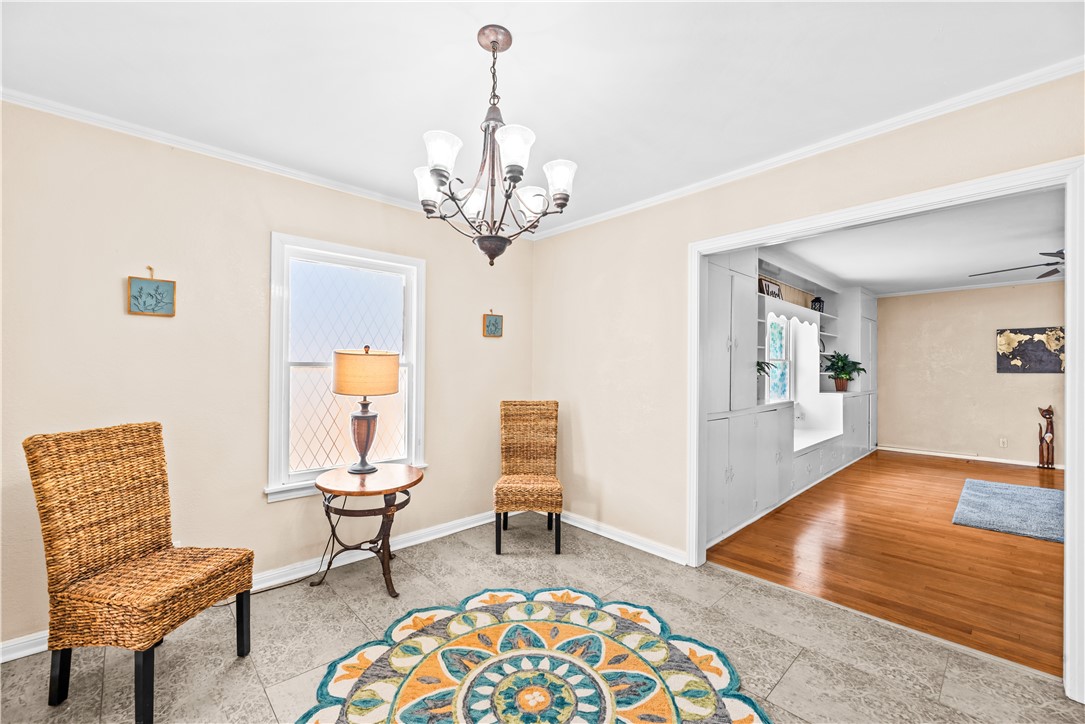 714 Indiana Avenue Corpus Christi, TX 78404 - Photo 10 of 38 a living room with furniture and a chandelier