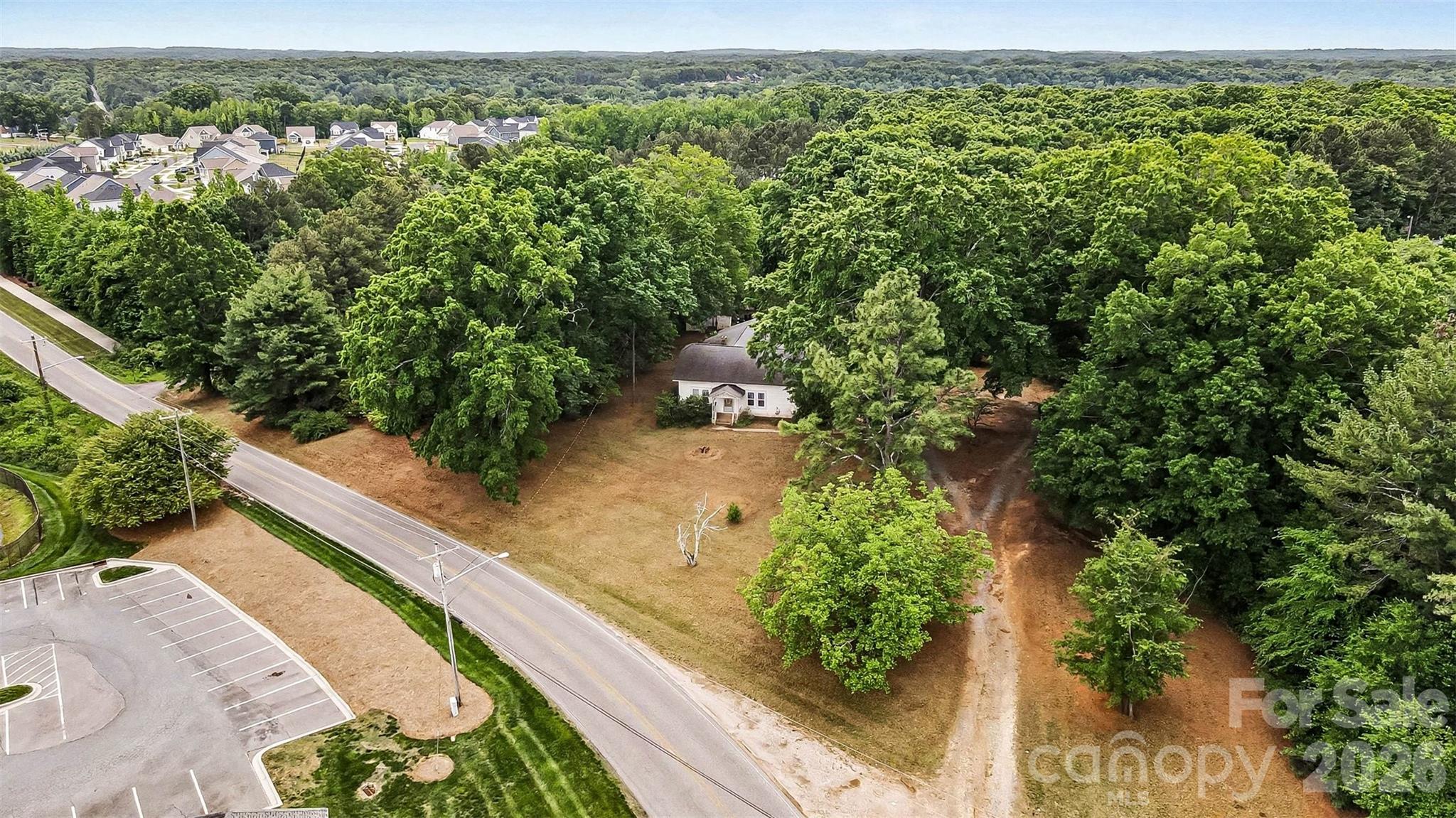 1116 Medlin Road Monroe, NC 28112 - Photo 36 of 40 an aerial view of a house with a yard basket ball court and outdoor seating