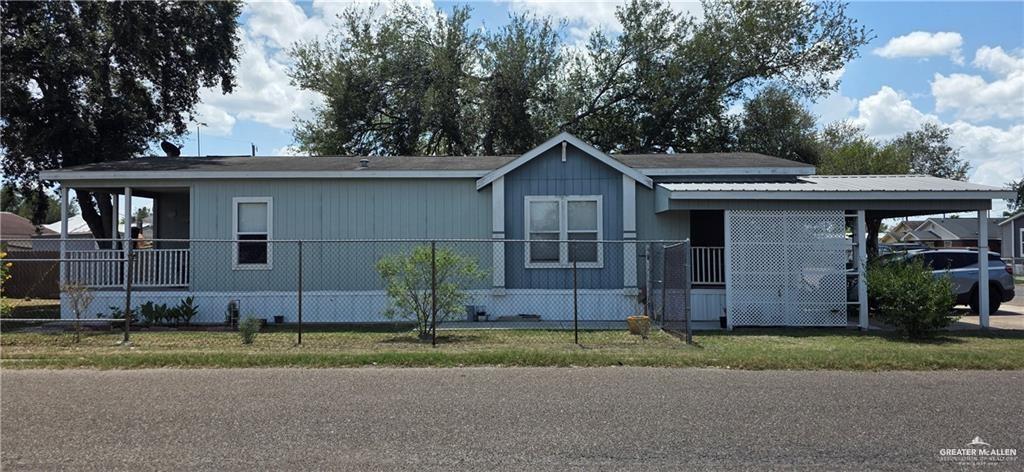 1406 West Ray Circle Mission, TX 78572 - Photo 22 of 22 a front view of a house with a garden