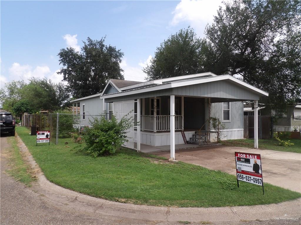 1406 West Ray Circle Mission, TX 78572 - Photo 3 of 22 a view of a house with a yard porch and sitting area