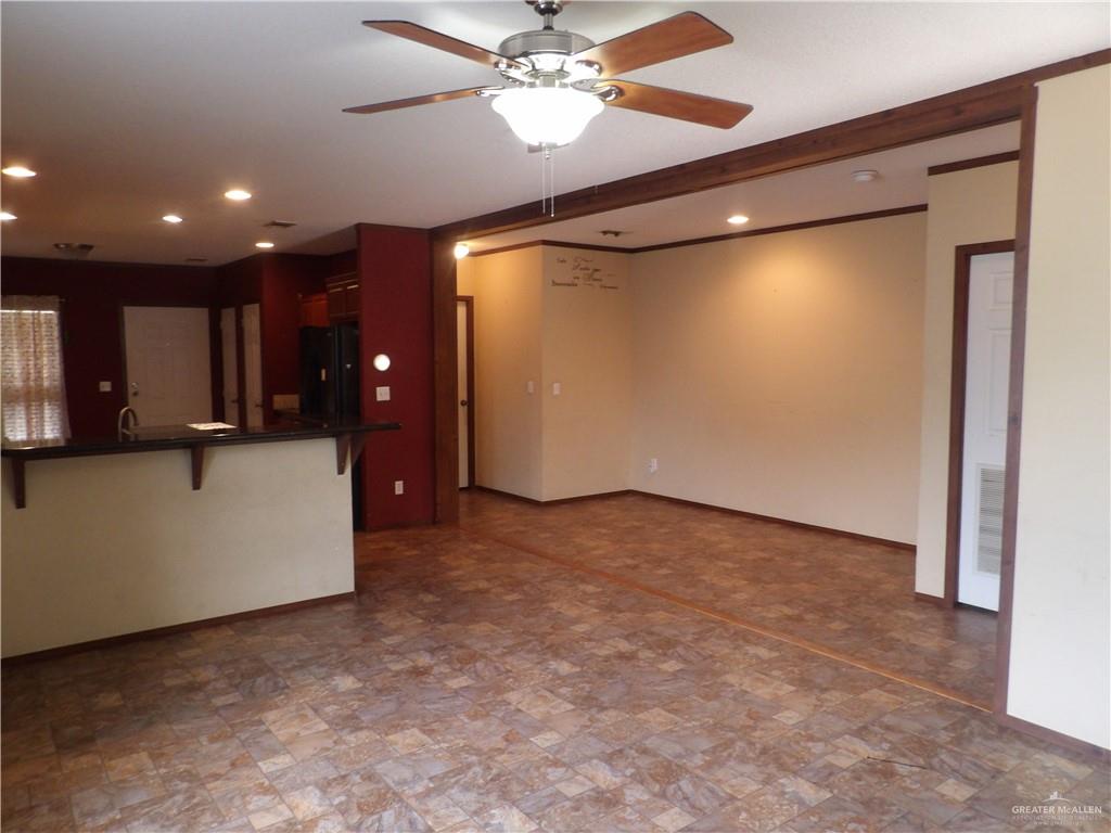 1406 West Ray Circle Mission, TX 78572 - Photo 8 of 22 a view of a livingroom with a kitchen