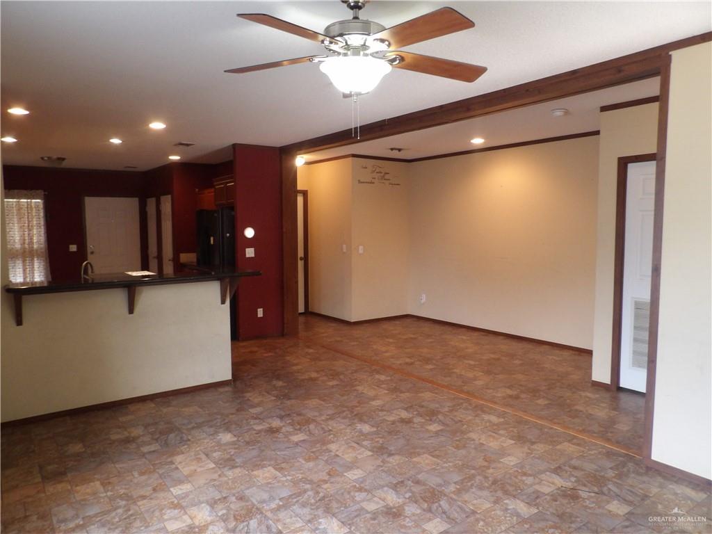 1406 West Ray Circle Mission, TX 78572 - Photo 9 of 22 a view of a livingroom with kitchen