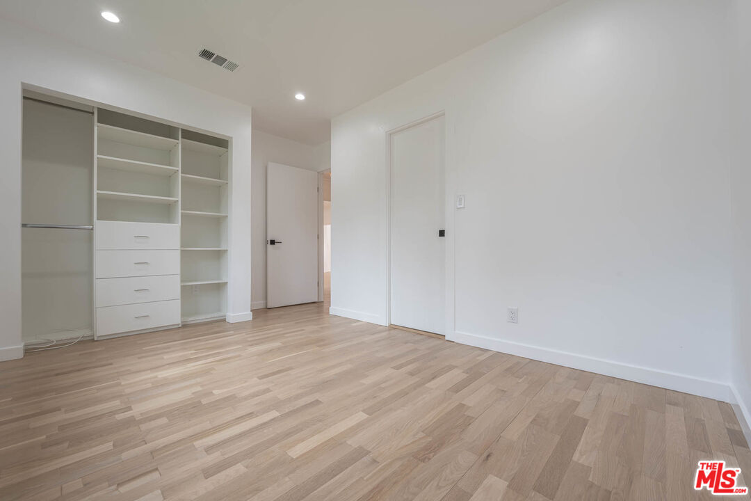 1216 Peck Drive Los Angeles, CA 90035 - Photo 15 of 29 a view of an empty room with closet and a window