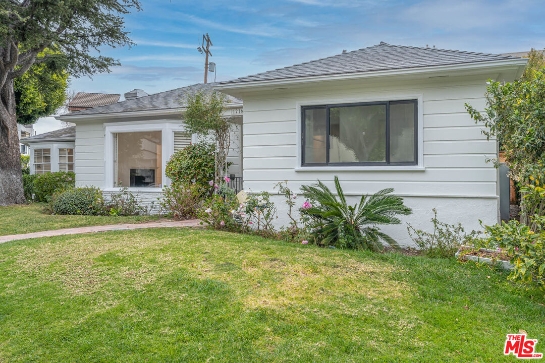 1216 Peck Drive Los Angeles, CA 90035 - Photo 2 of 29 a front view of a house with garden
