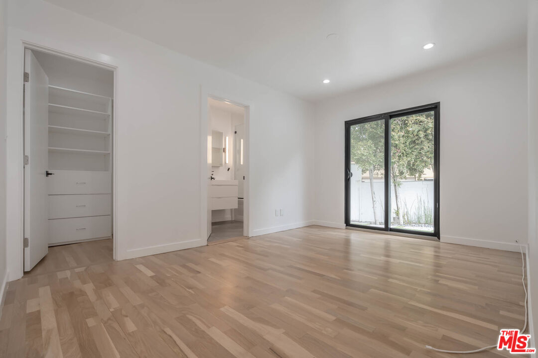 1216 Peck Drive Los Angeles, CA 90035 - Photo 24 of 29 wooden floor in an empty room with a window