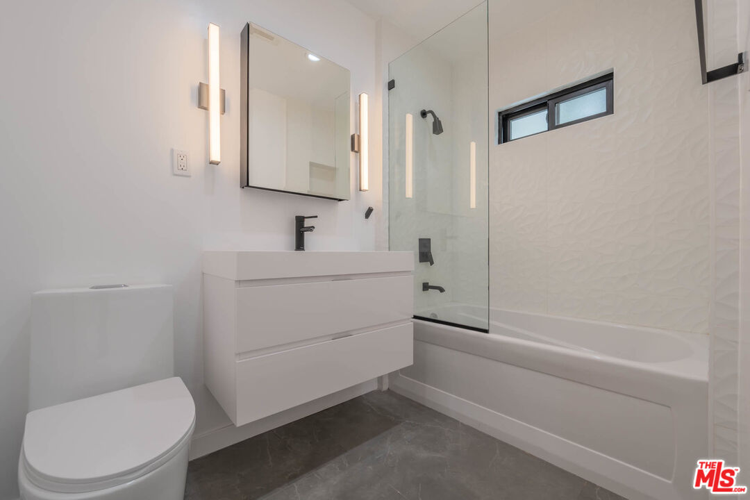 1216 Peck Drive Los Angeles, CA 90035 - Photo 26 of 29 a bathroom with a sink a toilet and shower