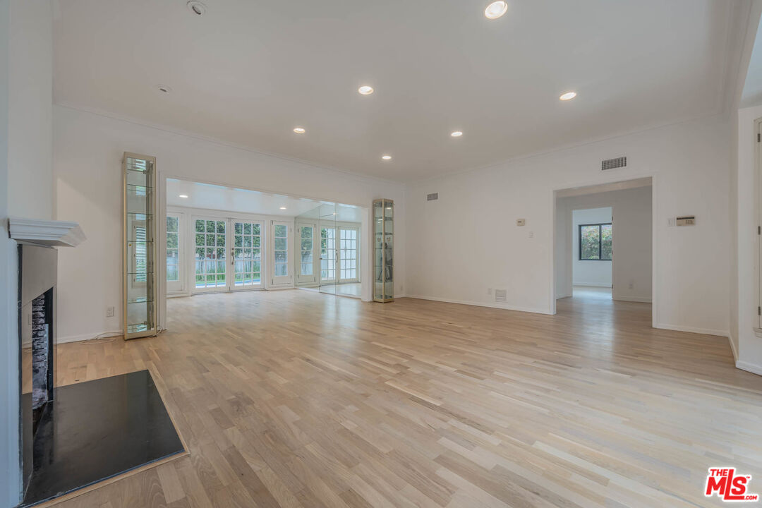 1216 Peck Drive Los Angeles, CA 90035 - Photo 3 of 29 a view of an empty room with wooden floor and a window
