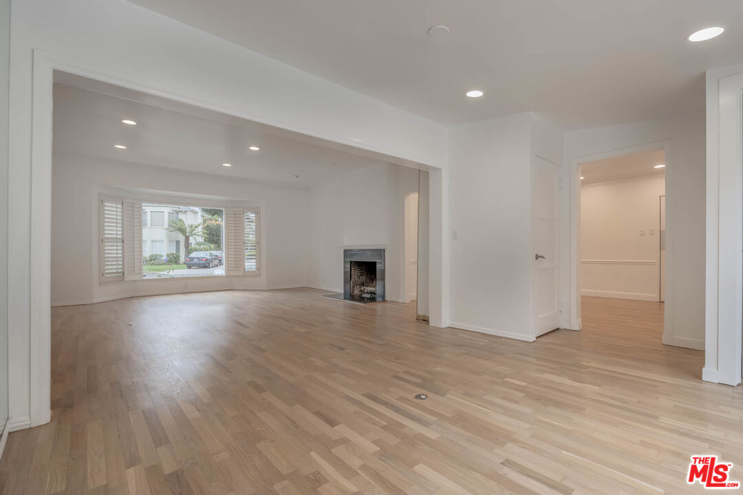 1216 Peck Drive Los Angeles, CA 90035 - Photo 7 of 29 an empty room with wooden floor and a window