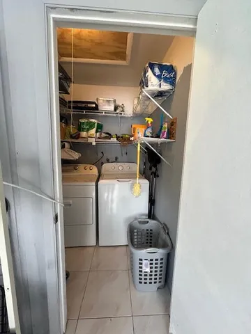 a room with water heater and utility racks