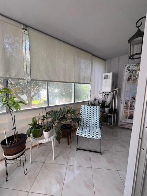 897 Flanders South, Unit 897 Delray Beach, FL 33484 - Photo 17 of 17 a kitchen with a sink and a stove top oven