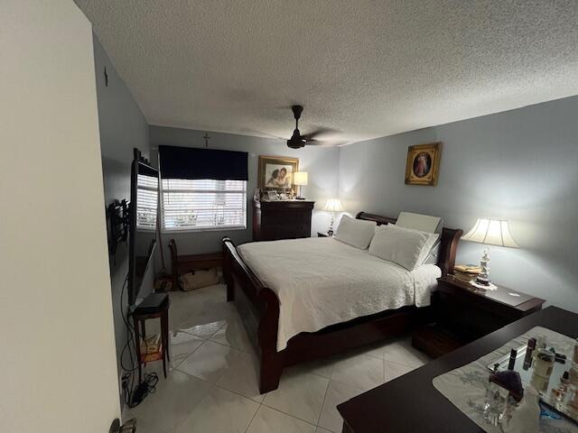 897 Flanders South, Unit 897 Delray Beach, FL 33484 - Photo 7 of 17 a bed room with a bed window and dresser