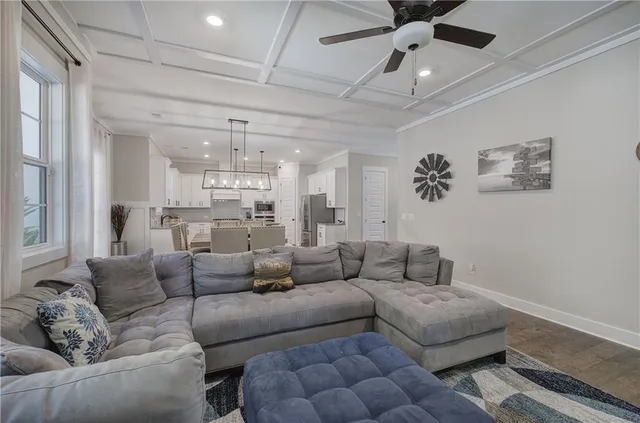 a kitchen with a sink a stove a microwave and cabinets