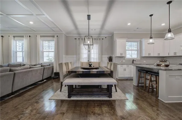 a kitchen with stainless steel appliances a refrigerator and cabinets