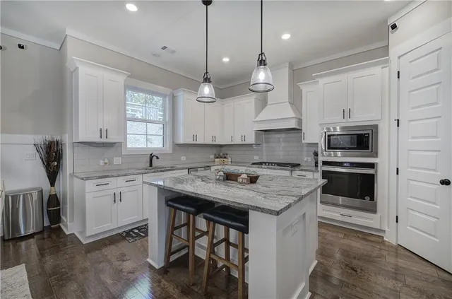 a bedroom with a large bed and closet