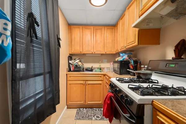 a kitchen with a stove and a refrigerator