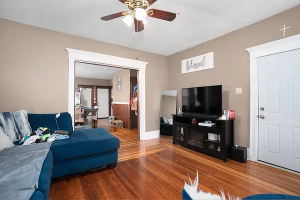 a living room with furniture and a flat screen tv