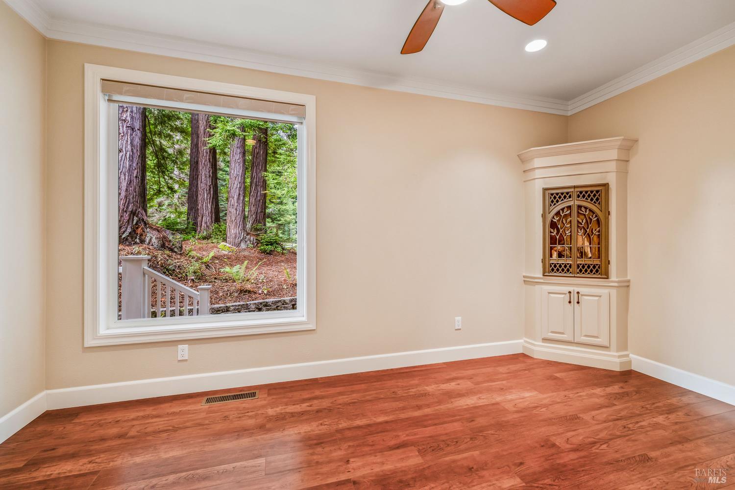 16611 Pearl Ranch Road Fort Bragg, CA 95437 - Photo 17 of 71 a view of an empty room with window and hardwood floor
