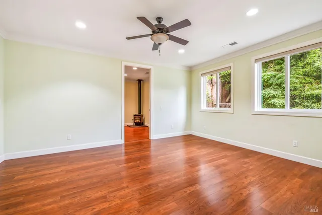 a bathroom with a granite countertop double vanity sink and a mirror