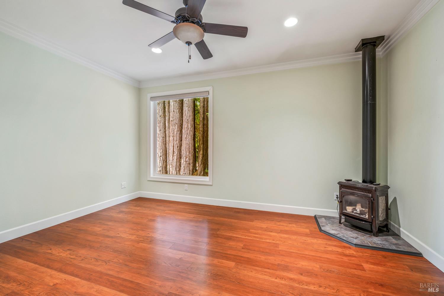 16611 Pearl Ranch Road Fort Bragg, CA 95437 - Photo 29 of 71 a view of an empty room with wooden floor and a window