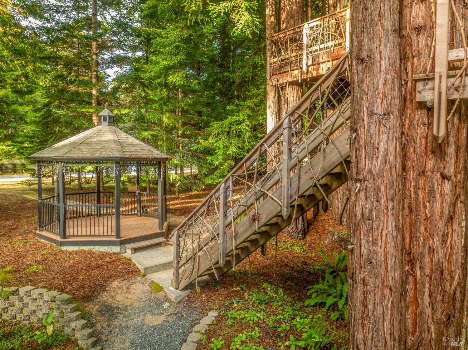 16611 Pearl Ranch Road Fort Bragg, CA 95437 - Photo 47 of 71 a roof deck with table and chairs under an umbrella