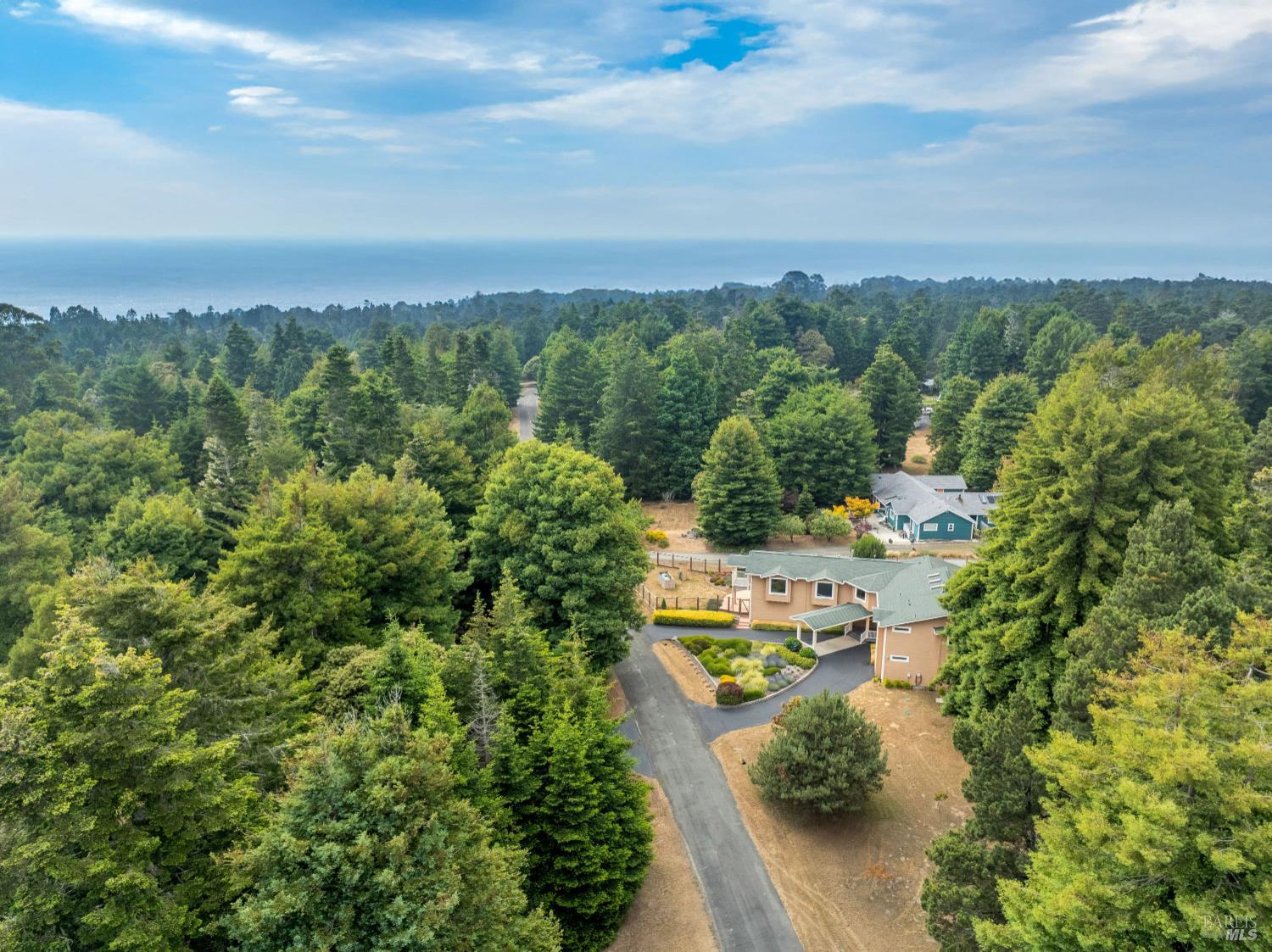 16611 Pearl Ranch Road Fort Bragg, CA 95437 - Photo 67 of 71 an aerial view of a city with lots of residential buildings ocean and mountain view in back