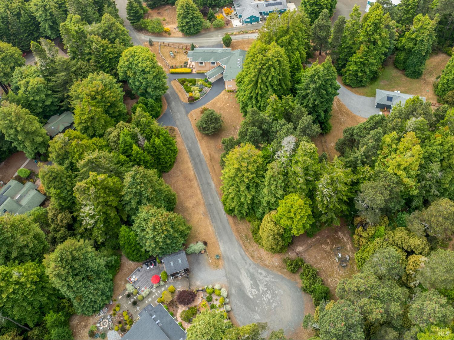 16611 Pearl Ranch Road Fort Bragg, CA 95437 - Photo 70 of 71 an aerial view of a house with a yard and trees all around