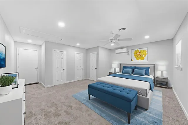 an empty room with a ceiling fan and entryway