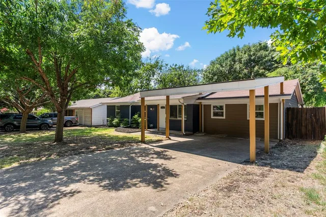 a front view of a house with a yard porch