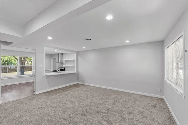a view of a kitchen with a sink and dishwasher cabinets