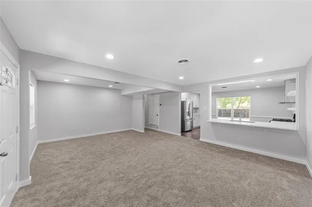 an empty room with windows and pillars in it