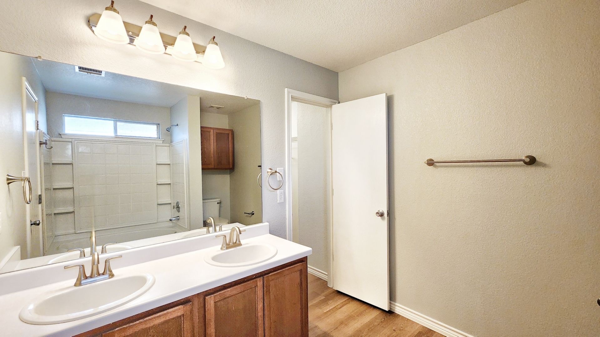 202 Brandons Way Buda, TX 78610 - Photo 12 of 16 a bathroom with a sink and a mirror