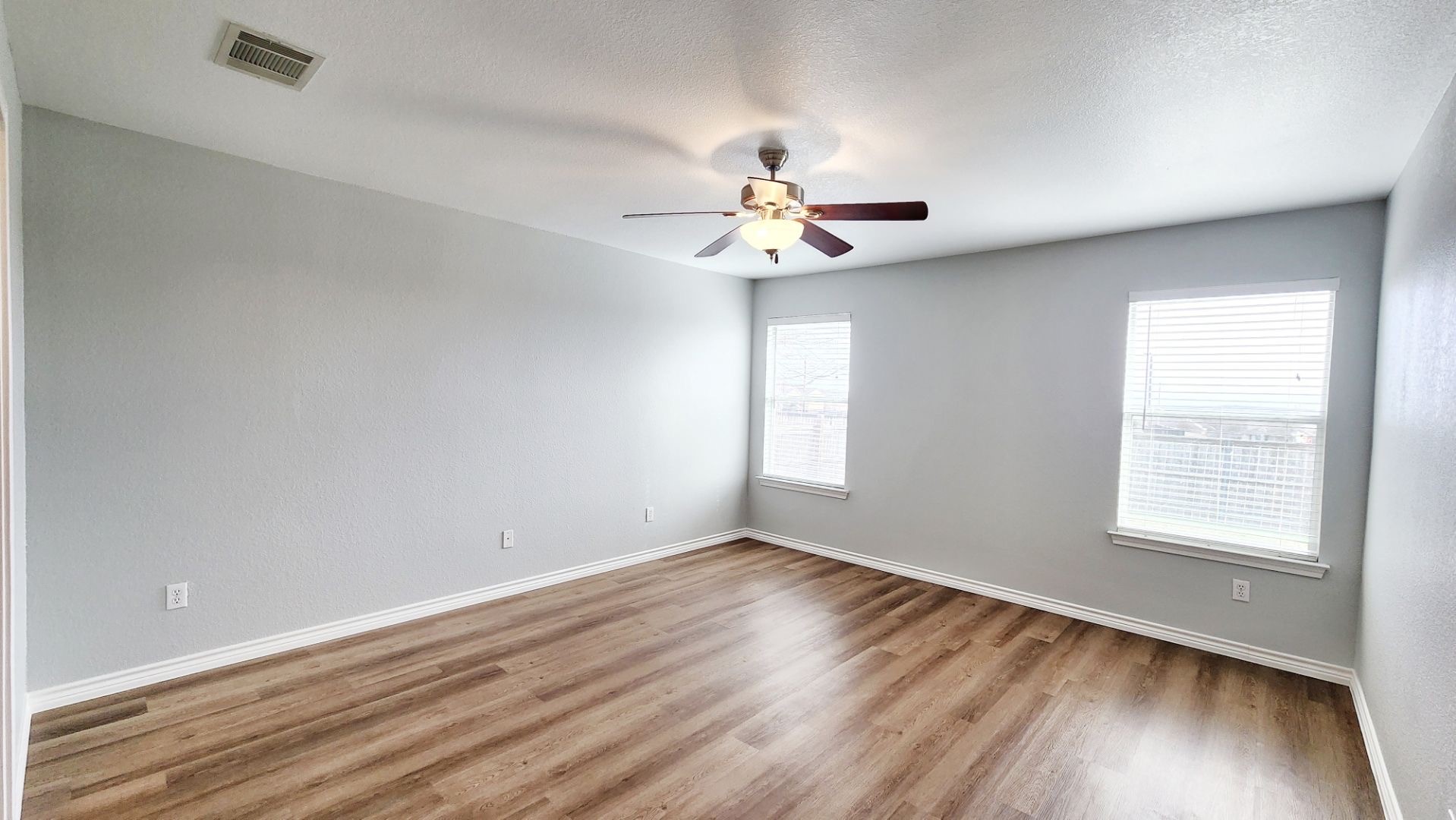 202 Brandons Way Buda, TX 78610 - Photo 13 of 16 wooden floor in an empty room with a window