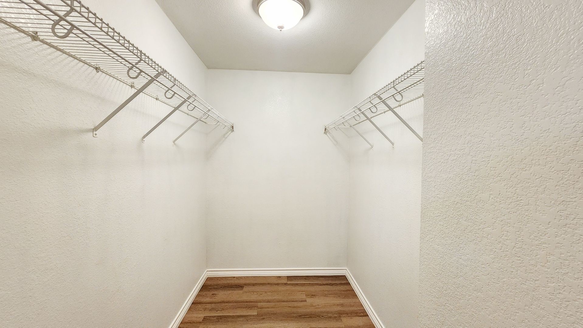 202 Brandons Way Buda, TX 78610 - Photo 14 of 16 a view of a room with racks on the wall