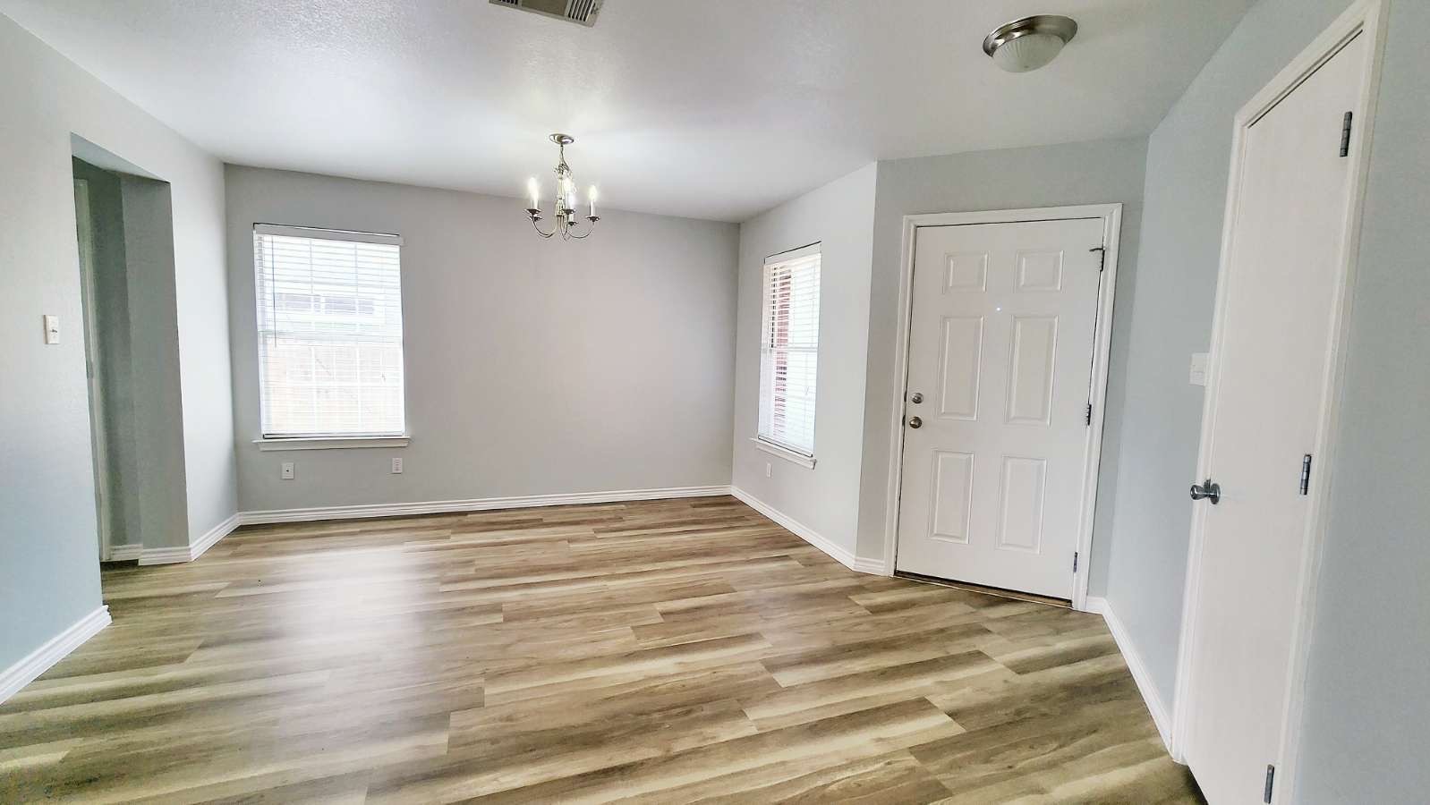 202 Brandons Way Buda, TX 78610 - Photo 3 of 16 wooden floor in an empty room with a window