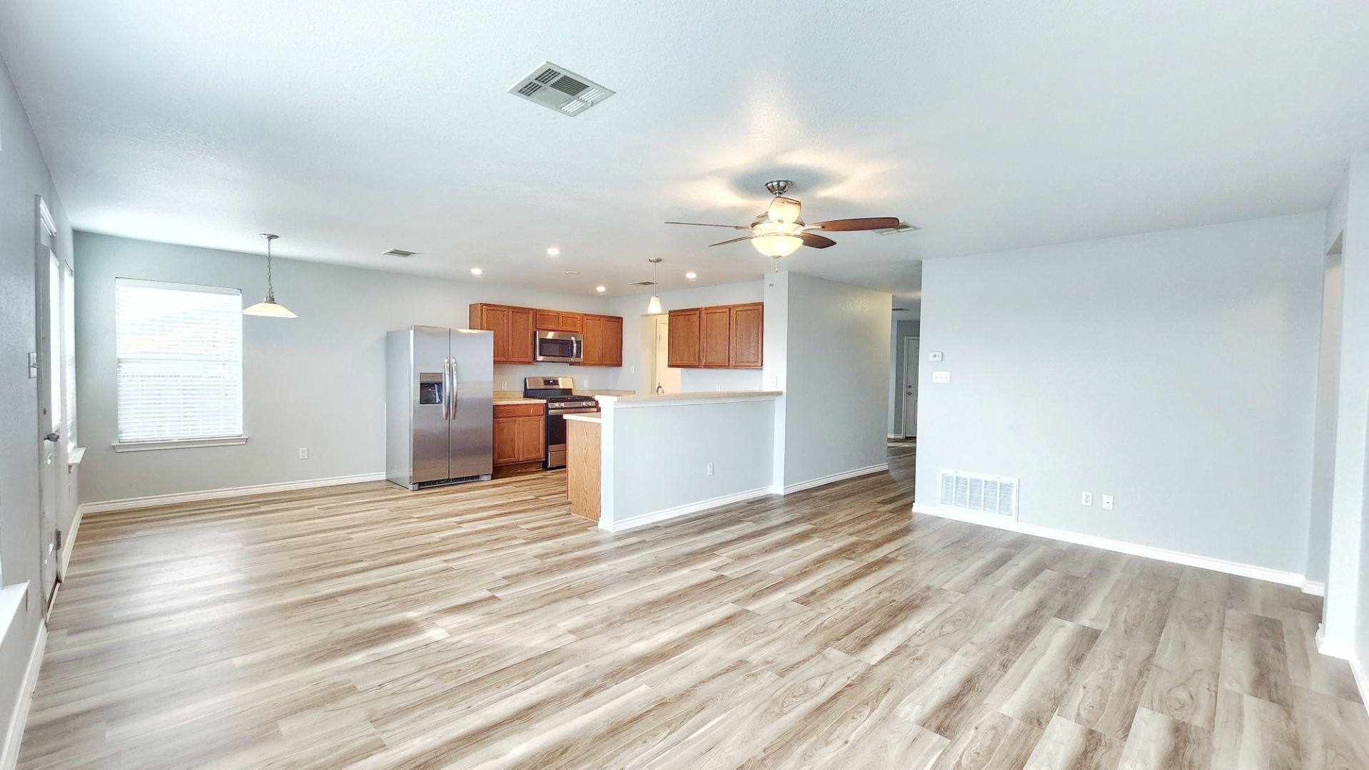 202 Brandons Way Buda, TX 78610 - Photo 6 of 16 a view of a kitchen with a sink and a window
