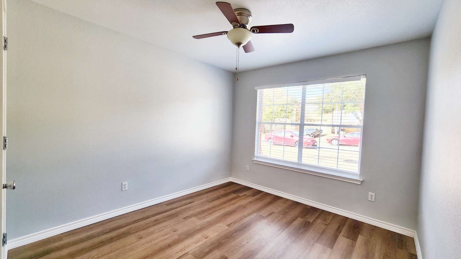202 Brandons Way Buda, TX 78610 - Photo 8 of 16 a view of empty room with wooden floor and fan