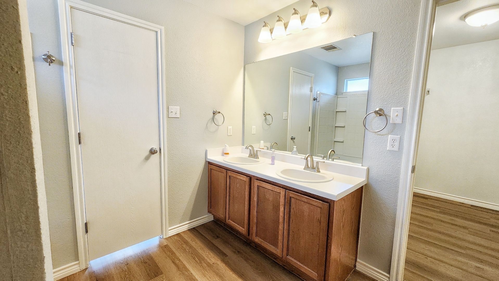 202 Brandons Way Buda, TX 78610 - Photo 9 of 16 a bathroom with a sink and a mirror