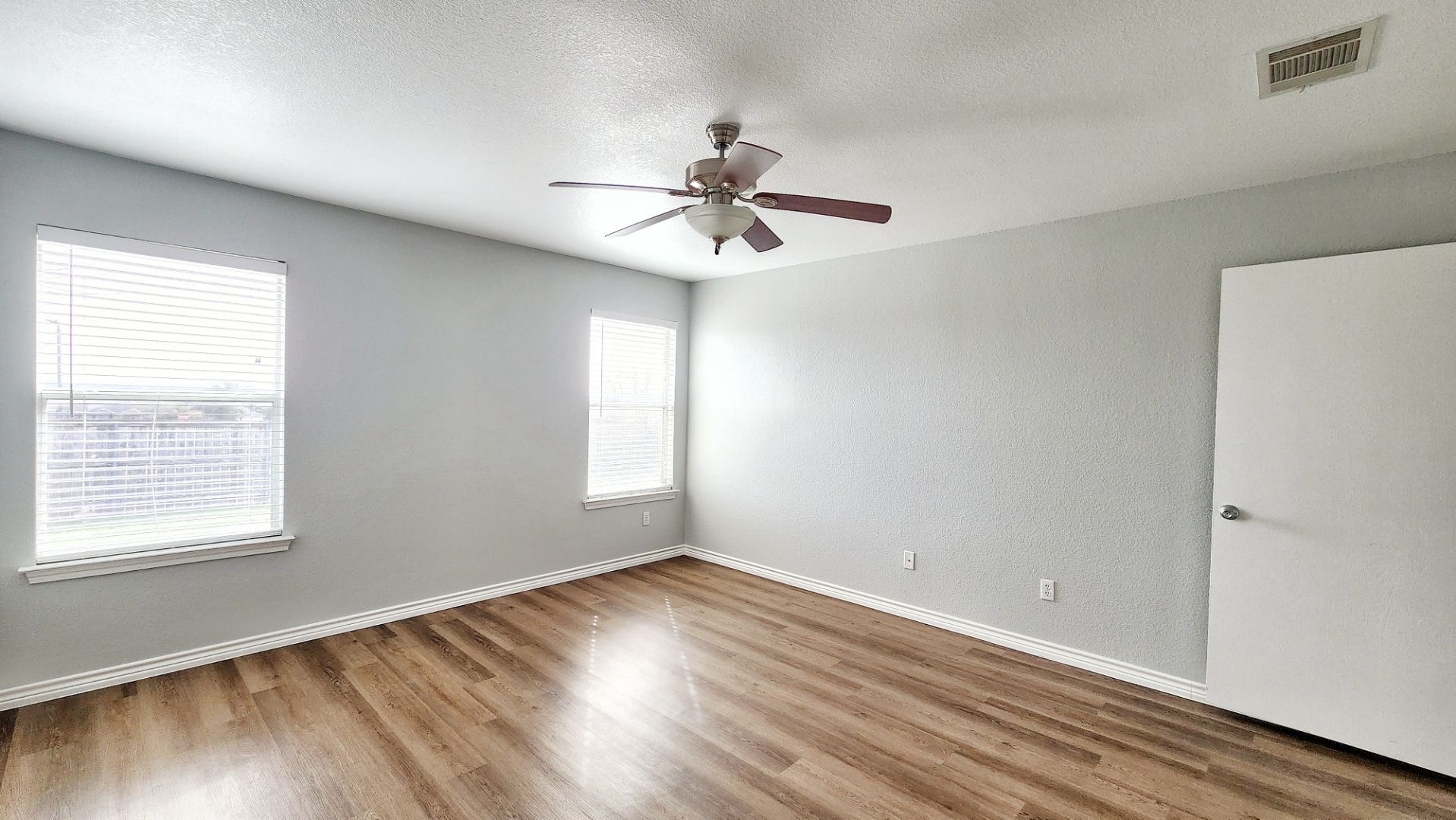 202 Brandons Way Buda, TX 78610 - Photo 10 of 16 a view of empty room with wooden floor and fan