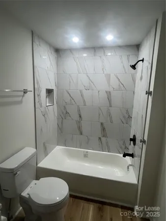 a bathroom with a sink a toilet and a bathtub