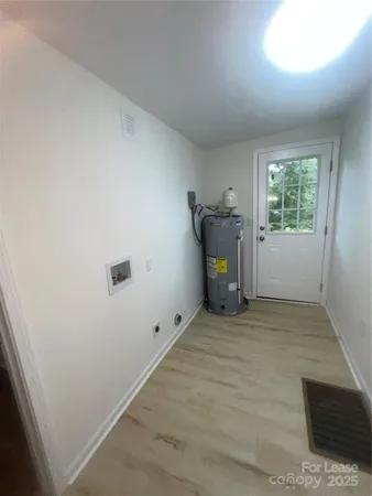 a view of empty room with a fireplace