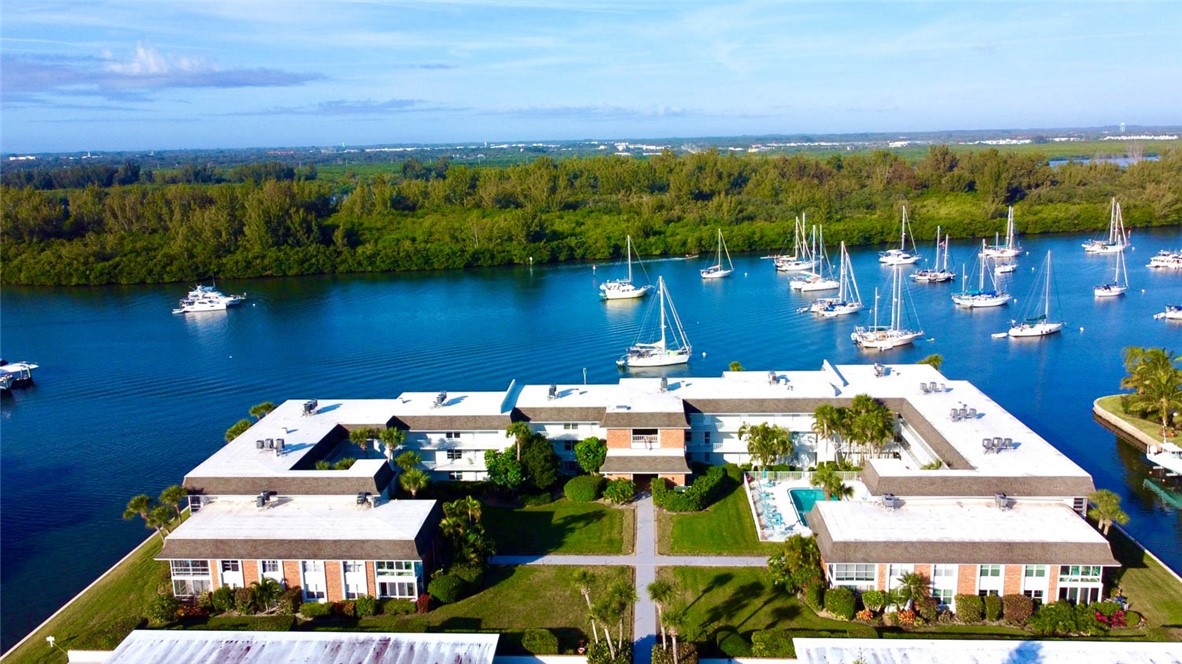 200 Greytwig Road, Unit 212 Vero Beach, FL 32963 - Photo 2 of 30 an aerial view of a house with a lake view