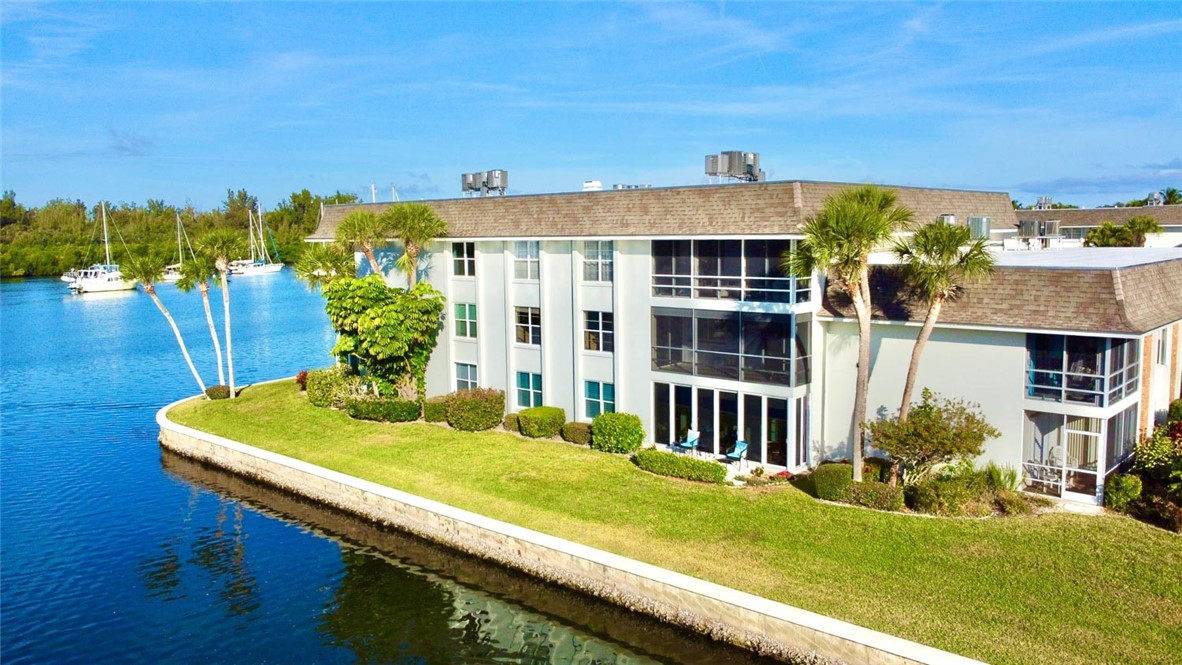 200 Greytwig Road, Unit 212 Vero Beach, FL 32963 - Photo 5 of 30 a view of a house with a yard balcony and furniture