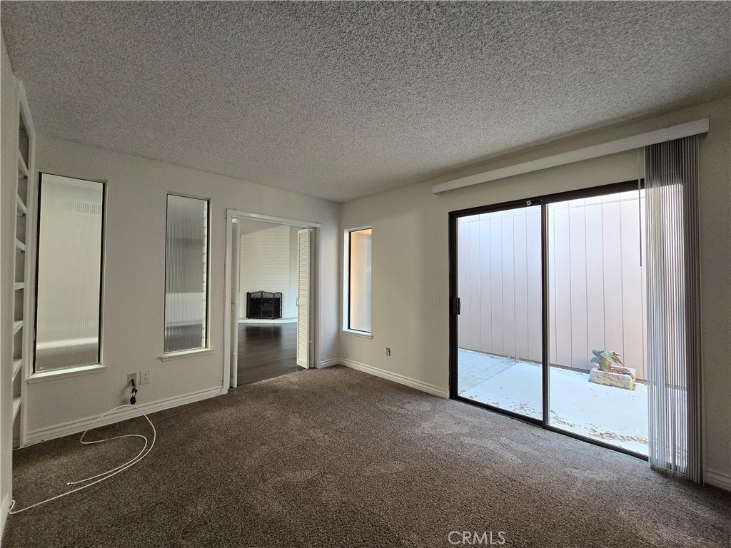 2595 Laramie Road Riverside, CA 92506 - Photo 13 of 29 an empty room with windows
