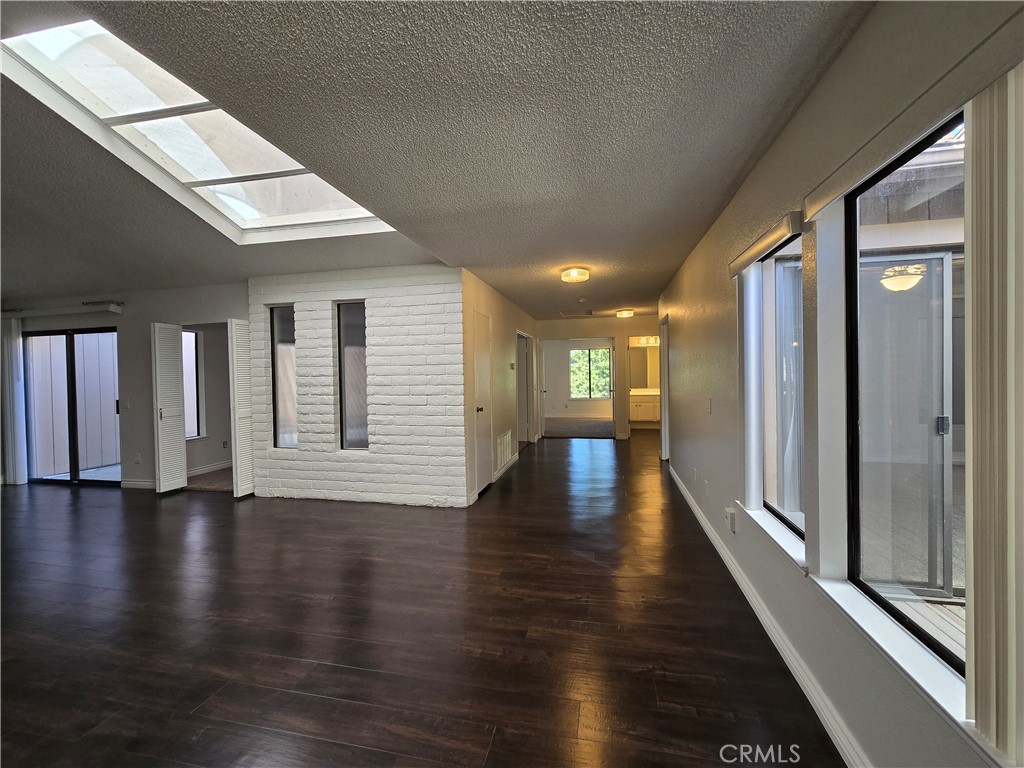 2595 Laramie Road Riverside, CA 92506 - Photo 15 of 29 a view of empty room with wooden floor and fan