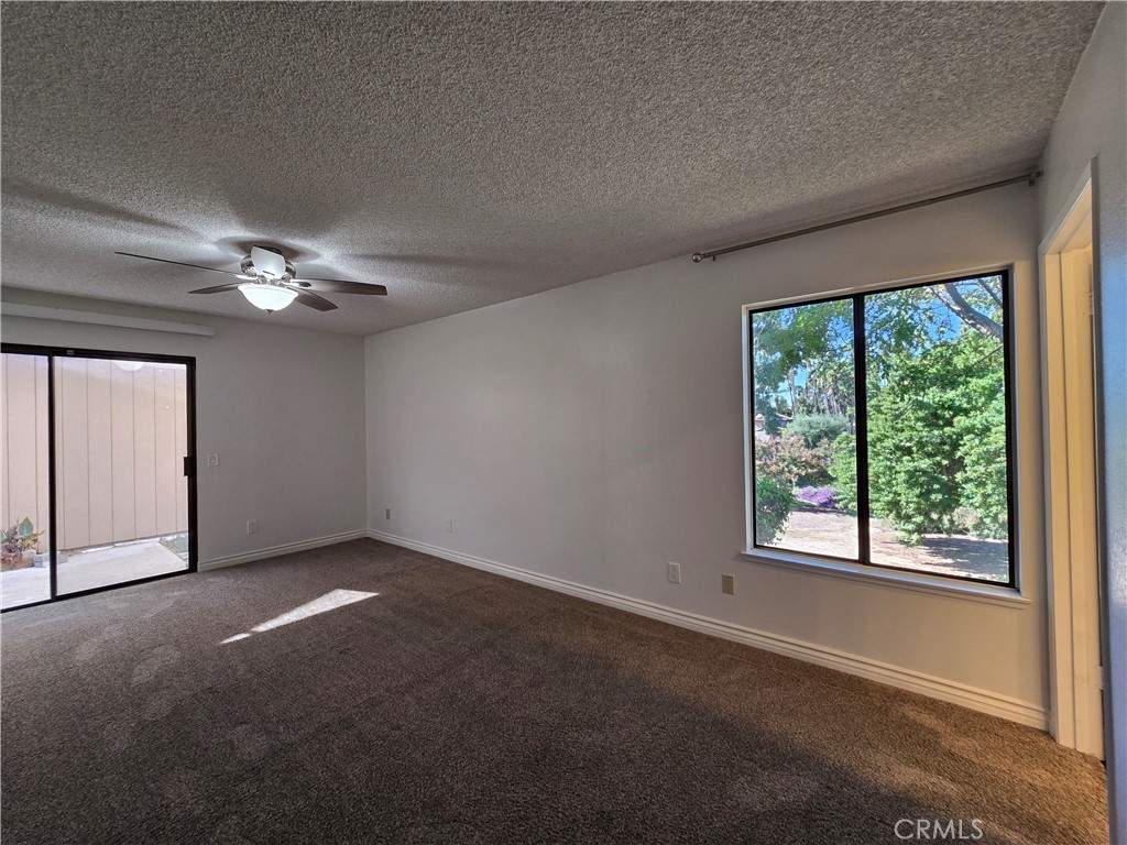 2595 Laramie Road Riverside, CA 92506 - Photo 23 of 29 a view of a livingroom with a ceiling fan and window