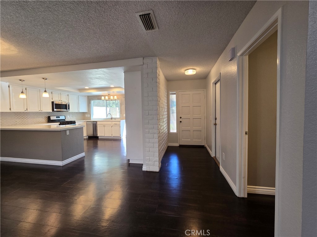2595 Laramie Road Riverside, CA 92506 - Photo 4 of 29 a view of a kitchen with wooden floor
