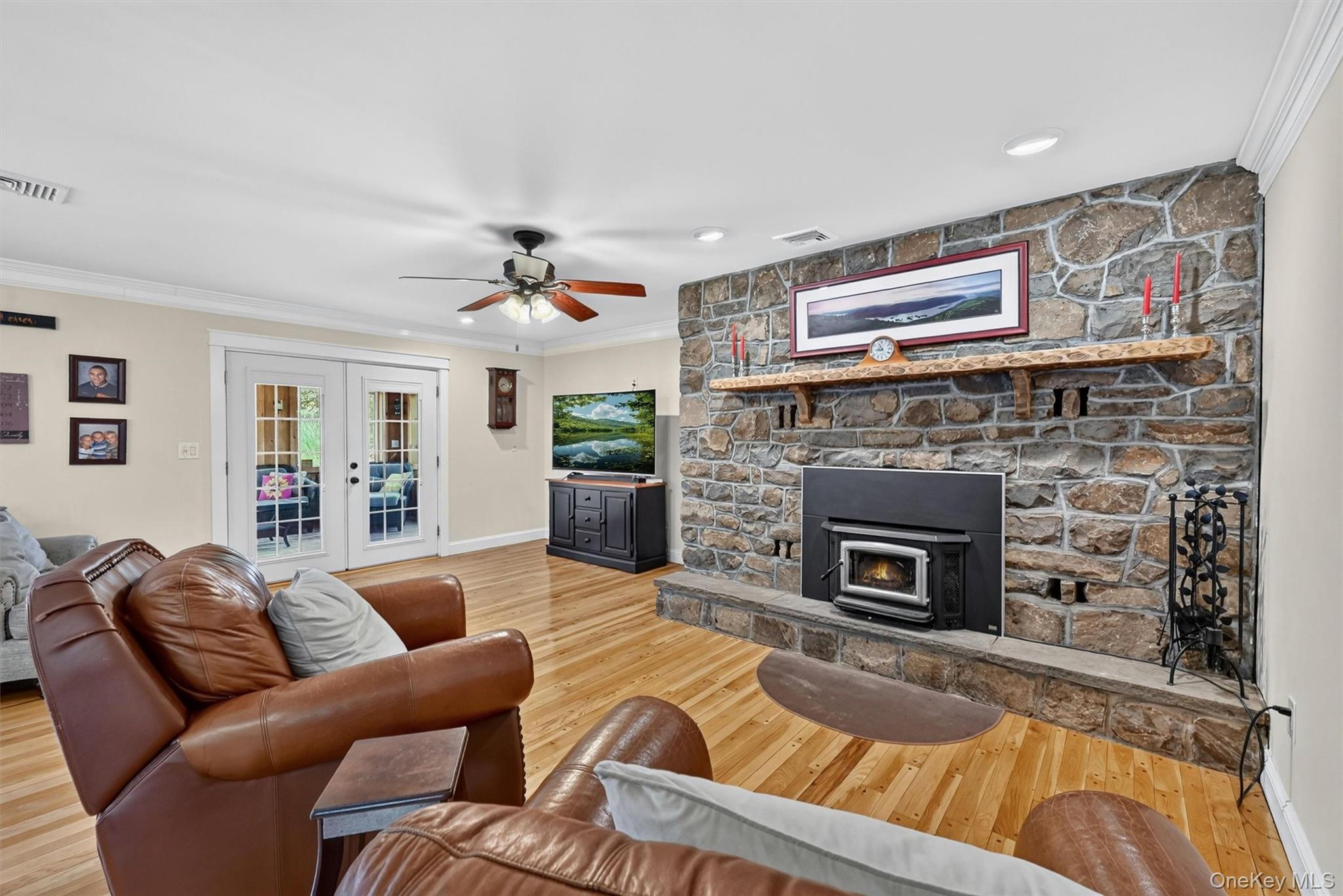 5 Hedges Road Warwick, NY 10990 - Photo 16 of 48 The spacious family room centers around a striking stone fireplace with a heat-efficient wood-burning insert, creating a warm and inviting place to gather.