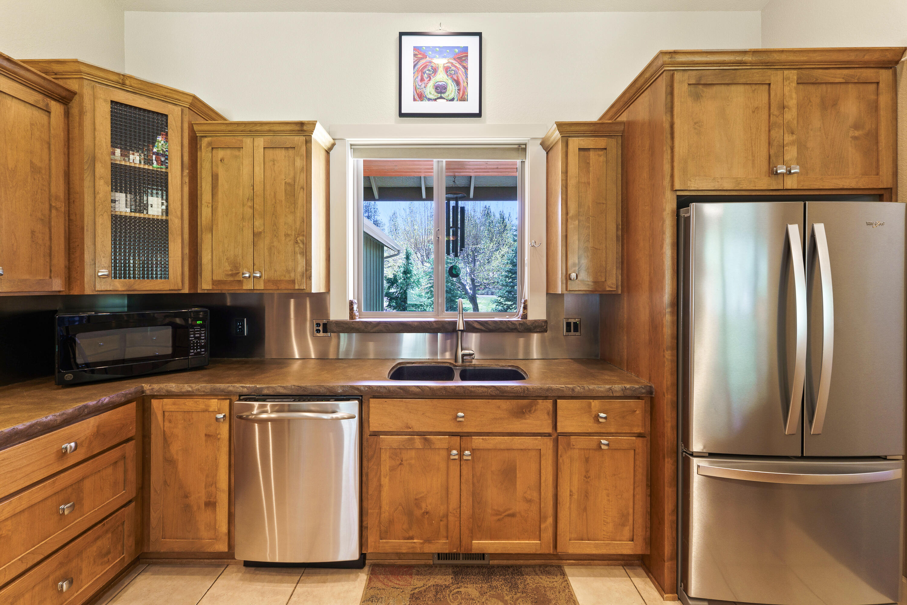 19236 Kiowa Road Bend, OR 97702 - Photo 18 of 52 a kitchen with stainless steel appliances granite countertop a refrigerator and a sink