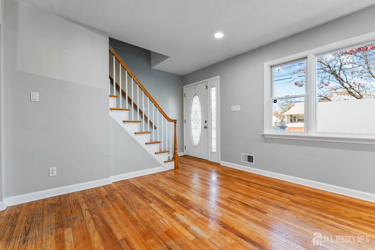 23 Alton Road Hamilton, NJ 08619 - Photo 20 of 40 a view of an empty room with wooden floor and a window