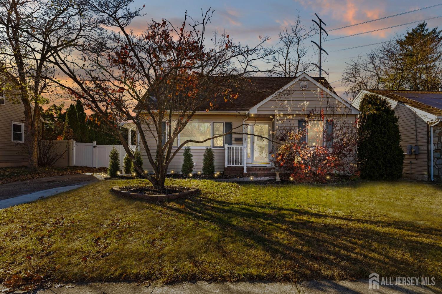 23 Alton Road Hamilton, NJ 08619 - Photo 2 of 40 a view of a house with a yard covered with snow in the background